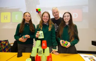 14/10/2025. SETU celebrated Ada Lovelace Day, Pictured at SETU Waterford Campus with Andrew Jeffrey – The Mathemagician with St. Paul’s Community College students Lucy Pepper Mcviney, Alyssa Rae Hennessy and Aamira Kamil. Photograph: Patrick Browne